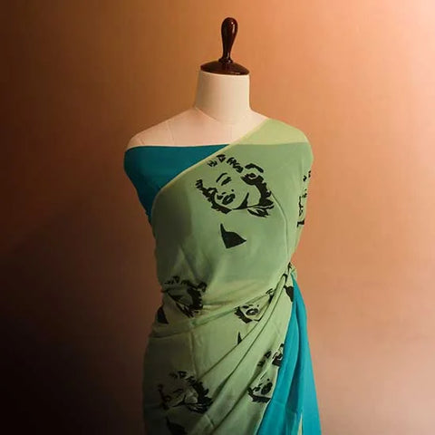 Pastel Green Shade styled with blue border and blouse Georgette saree