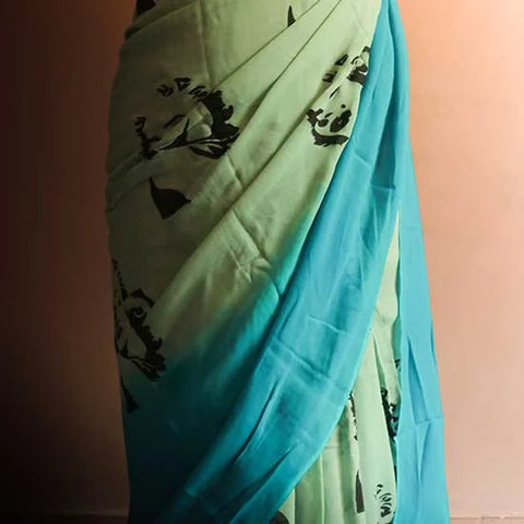 Pastel Green Shade styled with blue border and blouse Georgette saree